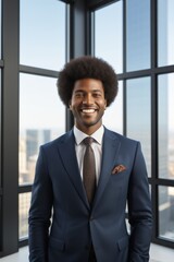 Fototapeta premium smiling man in suit and tie standing in front of a window