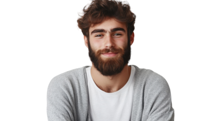 Smiling young man with a beard wearing a gray cardigan against a white background, projecting confidence and friendliness
