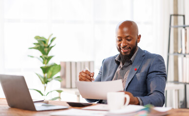 African American business man Accounting using calculating income-expenditure and analyzing real estate investment data report Financial and tax systems concept.	
