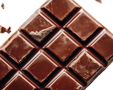 A pile of chocolate bars with cocoa beans in a marble background
