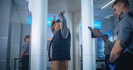 Airport Terminal: Elderly Man Passes Through Metal Detector Gates on Security Checkpoint. Security...