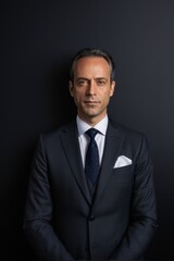 arafed man in a suit and tie posing for a picture