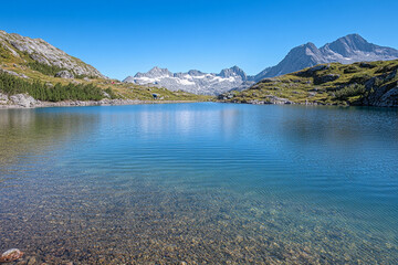 Breathtaking cosmic landscape featuring serene water and distant mountains during twilight