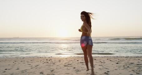 Fototapeta premium Woman, running and beach for vacation portrait, explore summer and travel to tropical island. Female person, ocean location and holiday in nature for wanderlust, tourist and Bali adventure by sea