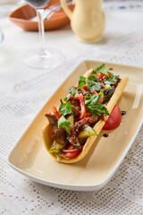 Vibrant Veal Salad with Vegetables in Lavash on Elegant Plate
