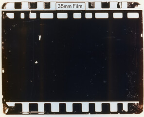 old film strip, underexposed 35mm film material on white. 