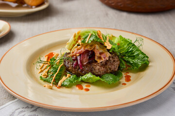 Elegant Beefsteak Presentation on Fresh Lettuce with Artistic Garnish