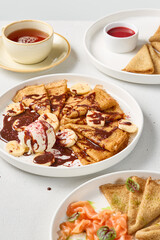 Delectable Crepes with Banana, Chocolate Sauce, and Ice Cream – A Gourmet Indulgence