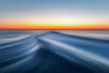 Sunset over calm ocean waters creates a serene atmosphere with vibrant colors on the horizon