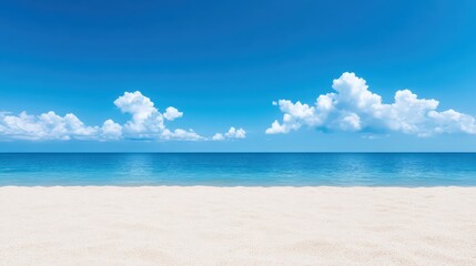 Fototapeta premium A beautiful beach with a clear blue sky and a calm ocean