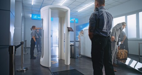 Airport Terminal Checkpoint: Diverse People Walking Through Metal Detector Gates, Taking Luggage...