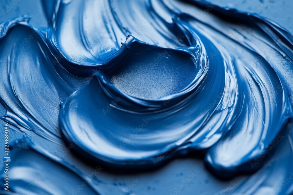 Leinwandbilder Swirling deep blue paint texture created with a palette knife on a canvas surface in a bright studio setting