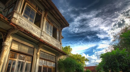 Fototapeta premium Majestic Abandoned Mansion Under Dramatic Sky