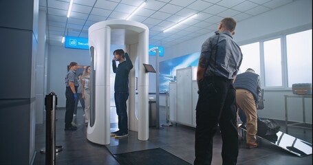 Airport Security Check: Diverse Passengers Passing Through Metal Detector Scanner, Taking Suitcases...