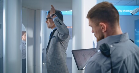 Airport Terminal: Mature Man Walks Through Metal Detector Scanner Gates on Security Checkpoint for...