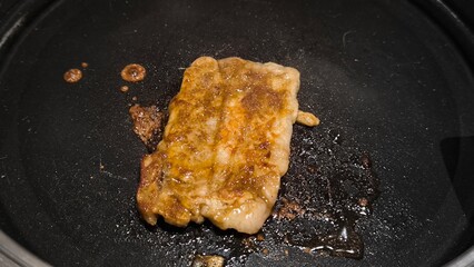 Korean style grilled beef on a black pan