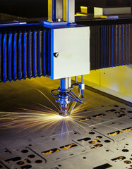 machine in action for laser cutting of metal sheet