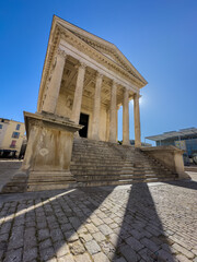 Maison Carree - restored roman temple dedicated to 'princes of youth', with richly decorated columns & friezes in Nimes, France
