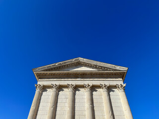 Maison Carree - restored roman temple dedicated to 'princes of youth', with richly decorated columns & friezes in Nimes, France