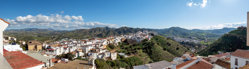 Fototapeta premium Panoramic view from above on the Andalusian white town of Alora, Spain, in a green winter landscape