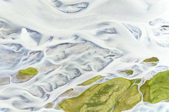 Abstract patterns in a river from a glacier.
