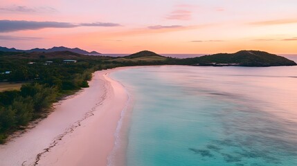 Serene Sunset Over Tranquil Beach with Clear Waters and Gentle Waves