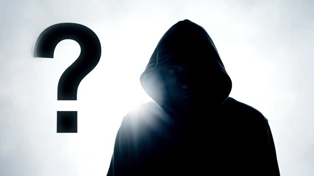 anonymously man,incognito,unknown person,person wanted. A mysterious man wearing a hoody does not see his face, has a question mark on the hood: the concept of finding the mysterious person.