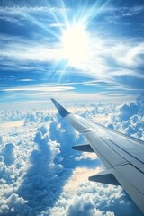 Fototapeta premium A plane is flying through a cloudy sky with the sun shining through the clouds
