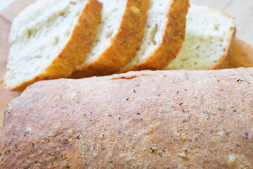 A loaf of crusty bread sliced and ready to be enjoyed