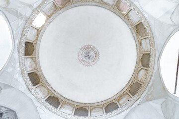 Circular ceiling of the main dome of the Agha Bozorg Mosque in Kashan, Iran. Window openings, sealed and latticed, are visible around the circle. Building was built in the late 18th century