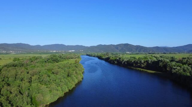 Aerial View of  river, Beautiful Aerial View of African Jungles forest and River, Landscape in aerial drone shot. Adove calm tranquil river in Jijel Algeria North Africa, River and green fores trees.