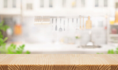 Empty, wood table top counter  island  on blur kitchen wall