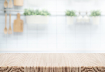 Empty, wood table top counter  island  on blur kitchen wall