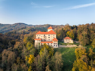 Naklejka premium Aerial autumn view with a beautiful building of the small old castle Stari Grad in Slovenia. .