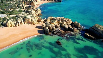 Best scenic becahes of Algarve coast, Portugal. scenic rocks of Praia dos arrifes and Praya da Vigia. Aerial drone 4k hd video.
