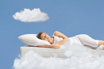 Young woman sleeping on a floating mattress
