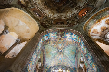 Interior of an ancient church with intricate mosaics and frescoes