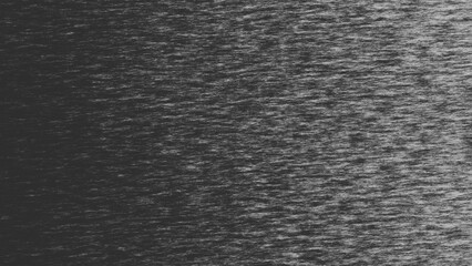 Grainy textured fabric background with gradient, showing subtle light reflection, perfect for website design or print