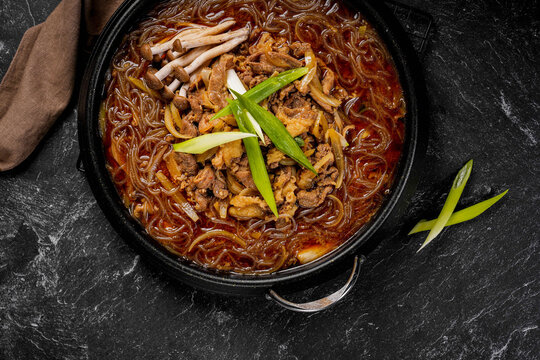 Bulgogi Jeongol is a Korean hot pot dish containing marinated beef slices (bulgogi), various vegetables (such as mushrooms, Chinese cabbage, and onions), and glass noodles (Korean vermicelli/dangmyeon