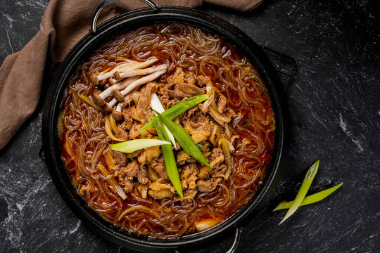 Bulgogi Jeongol is a Korean hot pot dish containing marinated beef slices (bulgogi), various vegetables (such as mushrooms, Chinese cabbage, and onions), and glass noodles (Korean vermicelli/dangmyeon