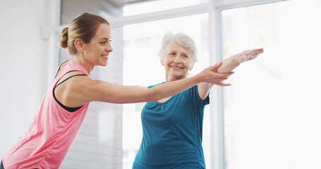 Obraz premium Yoga, coach and help senior woman for fitness, healthy body and geriatric wellness. Stretching, happy instructor and pilates exercise for physical therapy, assistance and balance together in gym