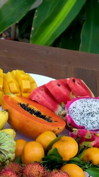 Thai Fresh Exotic Fruits (Pineapple, Coconut, Mango, Rambutan, Masngosteen, Dragon Fruit, Rose Apple, Sugar Apple, Snake Fruit) on the Table. Healthy Vitamin Nutritious Food. 