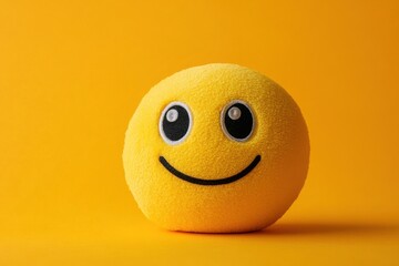 A joyful emoji face glowing with happiness in vivid yellow tones, embodying positivity and simplicity for playful designs and cheerful communications