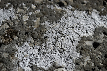 abstract close-up of salt mineral on sealed concrete floor in winter weather surface texture residue from tires background
