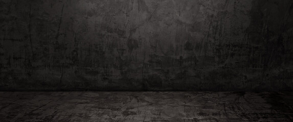 empty dark black and grey studio backdrop. well editing wall and floor concrete perspective for display product and text present. empty room with free space use as backdrop photo in panorama view.