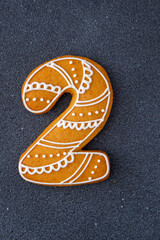 Decorated Gingerbread Cookie Number Two. Food background. Christmas decoration