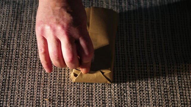 Wrapping gift in brown paper