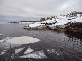 Winter landscape of the Rautalahti Peninsula in Lake Ladoga in the Republic of Karelia: big stones,...