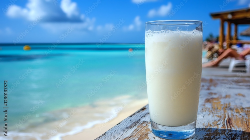 Poster refreshing coconut drink served on a wooden beach table golden sand and crystal waters in the backgr