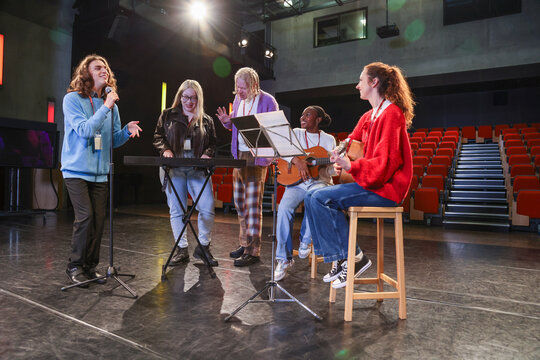 Friends playing and singing during rehearsal - Powered by Adobe